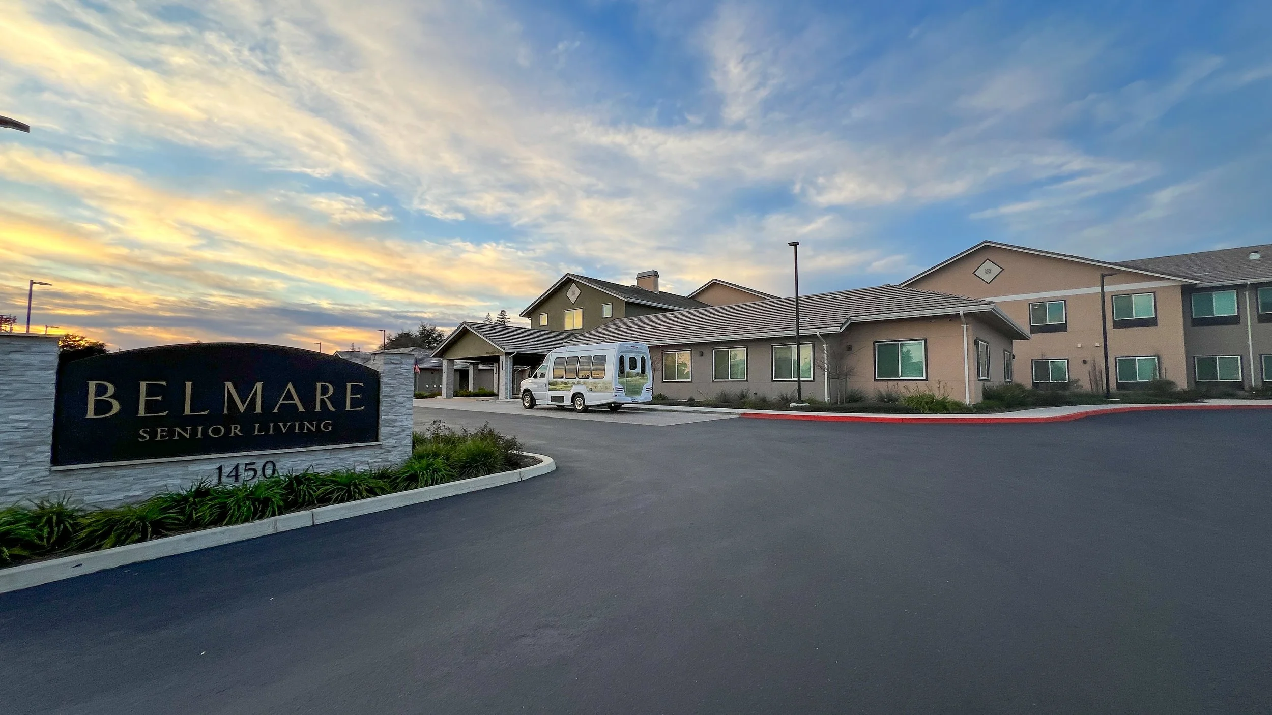 Belmare Senior Living exterior at sunset