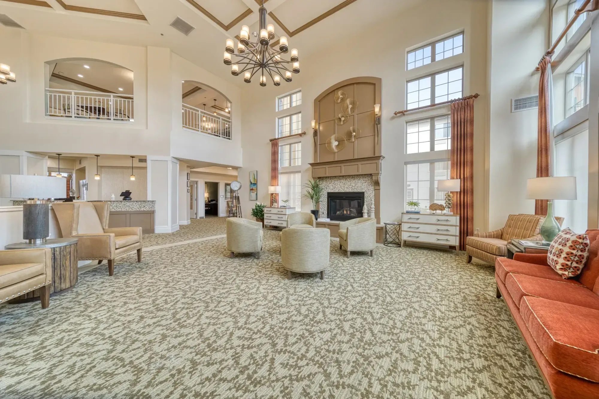 Spacious lobby with fireplace and chandelier